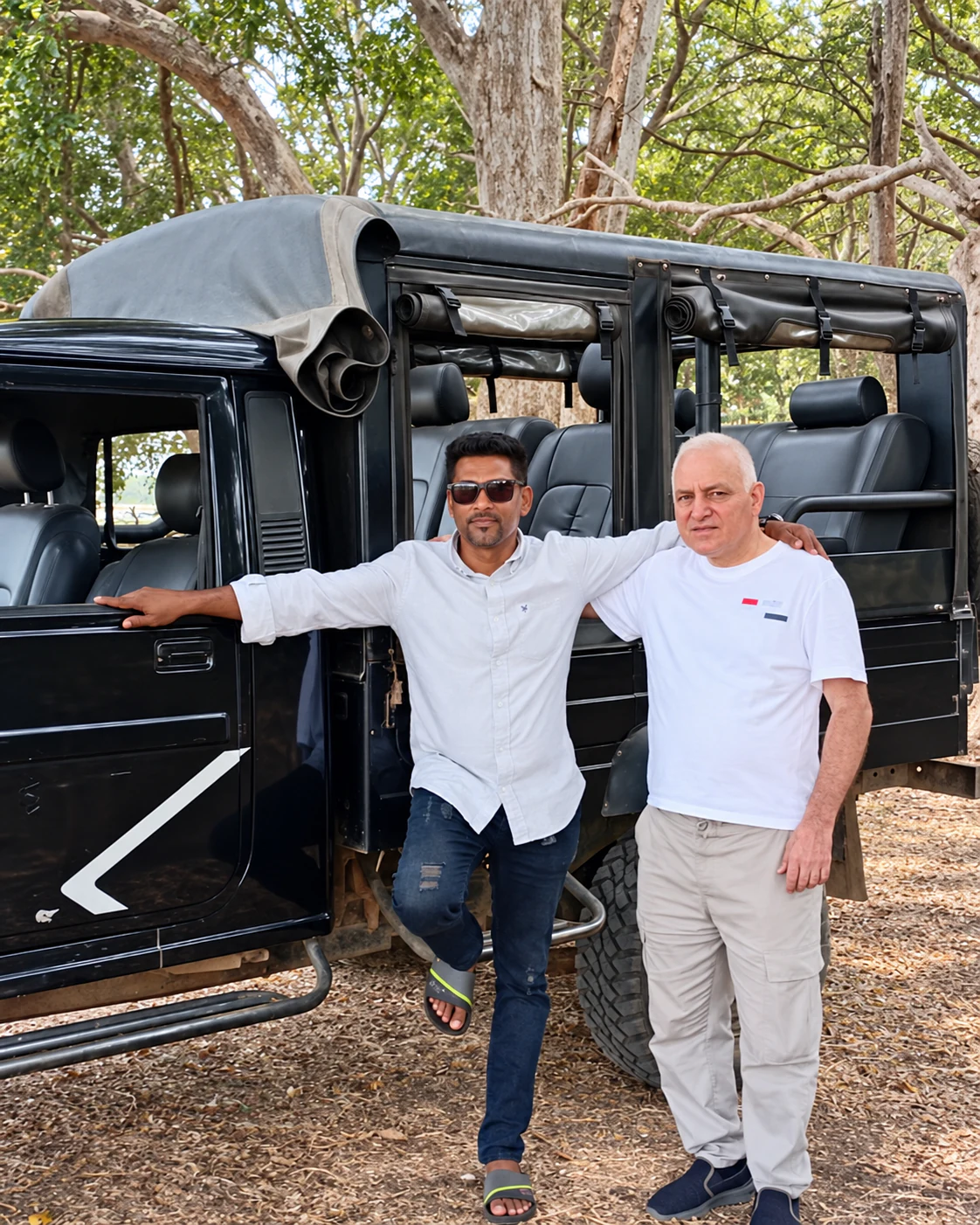 Sagara Mihidu Kulasooriya with a guest beside a Sri Lanka safari jeep